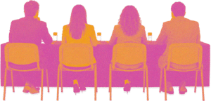 Four people seated in a row at a conference table, seen from behind, with drinks in front of them on a meeting or panel setting
